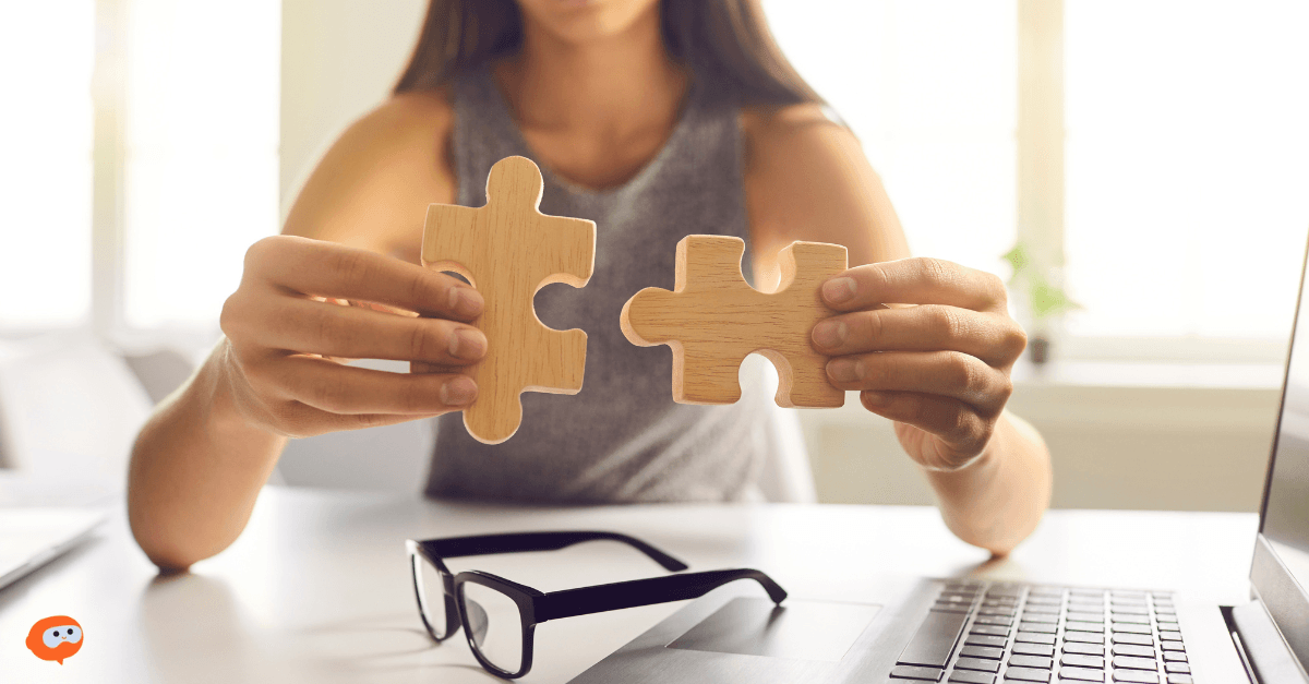 A woman working on a puzzle, as if she’s solving a problem